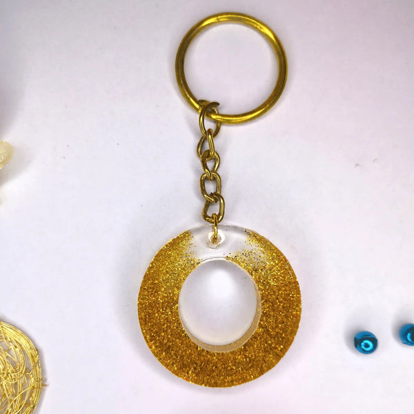 Stylish Golden Glitter Resin Keychain – Elegant "G" Initial