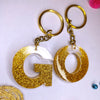 Stylish Golden Glitter Resin Keychain – Elegant "G" Initial