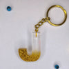 Stylish Golden Glitter Resin Keychain – Elegant "G" Initial
