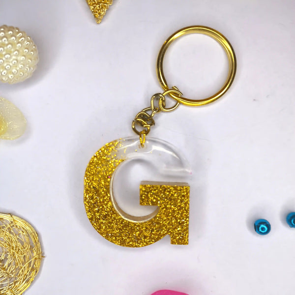 Stylish Golden Glitter Resin Keychain – Elegant "G" Initial