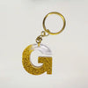 Stylish Golden Glitter Resin Keychain – Elegant "G" Initial