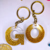 Stylish Golden Glitter Resin Keychain – Elegant "G" Initial